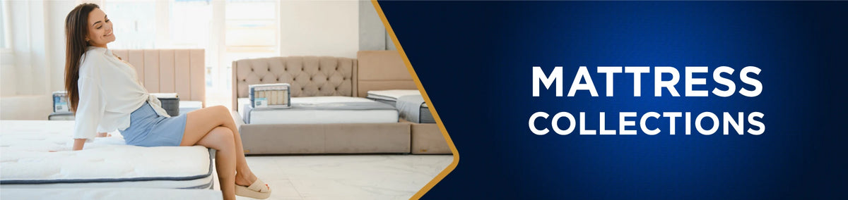 Woman smiling while sitting on a mattress in a showroom, banner for Mattress Collections