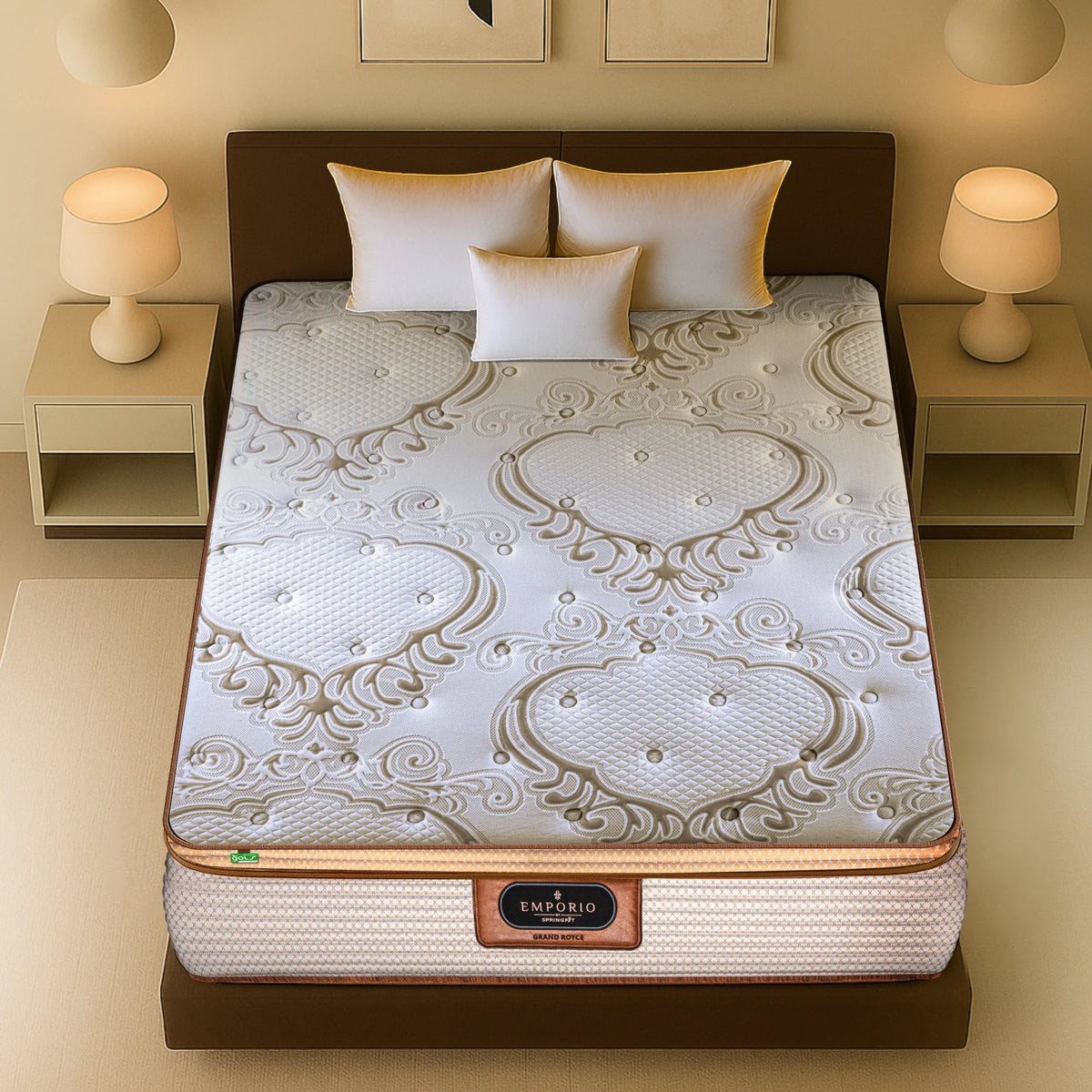 Top-down view of Springfit Emporio Grand Royce mattress showcasing the premium baroque-style embossed white and gold fabric surface with white and gold accent pillows