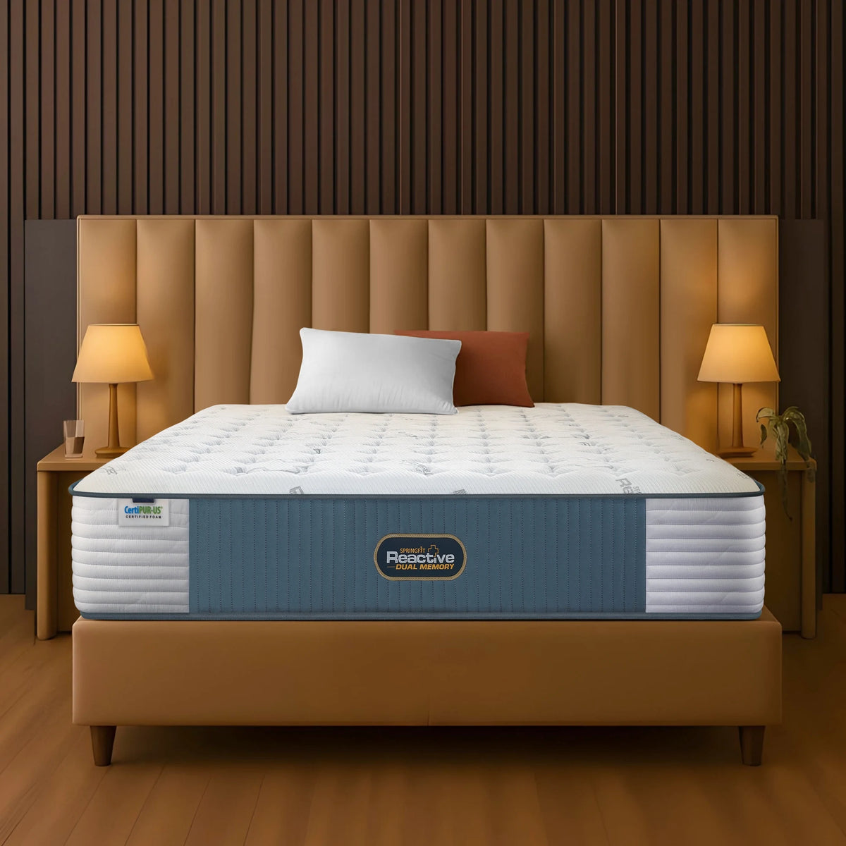 Springfit Reactive Dual Memory mattress on beige channeled headboard platform bed with white and terracotta pillows in warm wood-paneled bedroom with matching golden side lamps and wooden nightstands